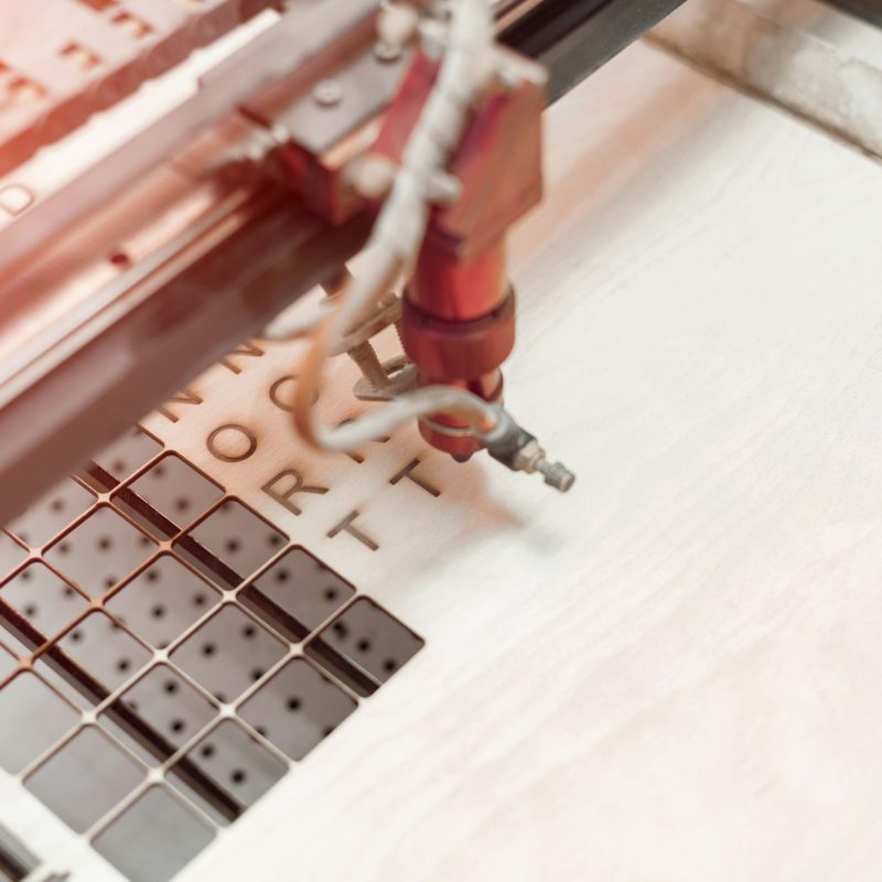 Laser plywood machine in process close up.